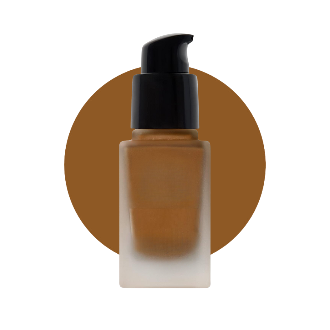 Liquid makeup for brown skin tones in a frosty glass bottle and a black pump.