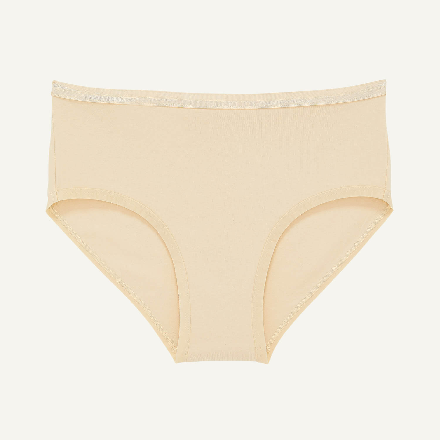 A pair of beige nude women's underwear by Subset/ Knickey.