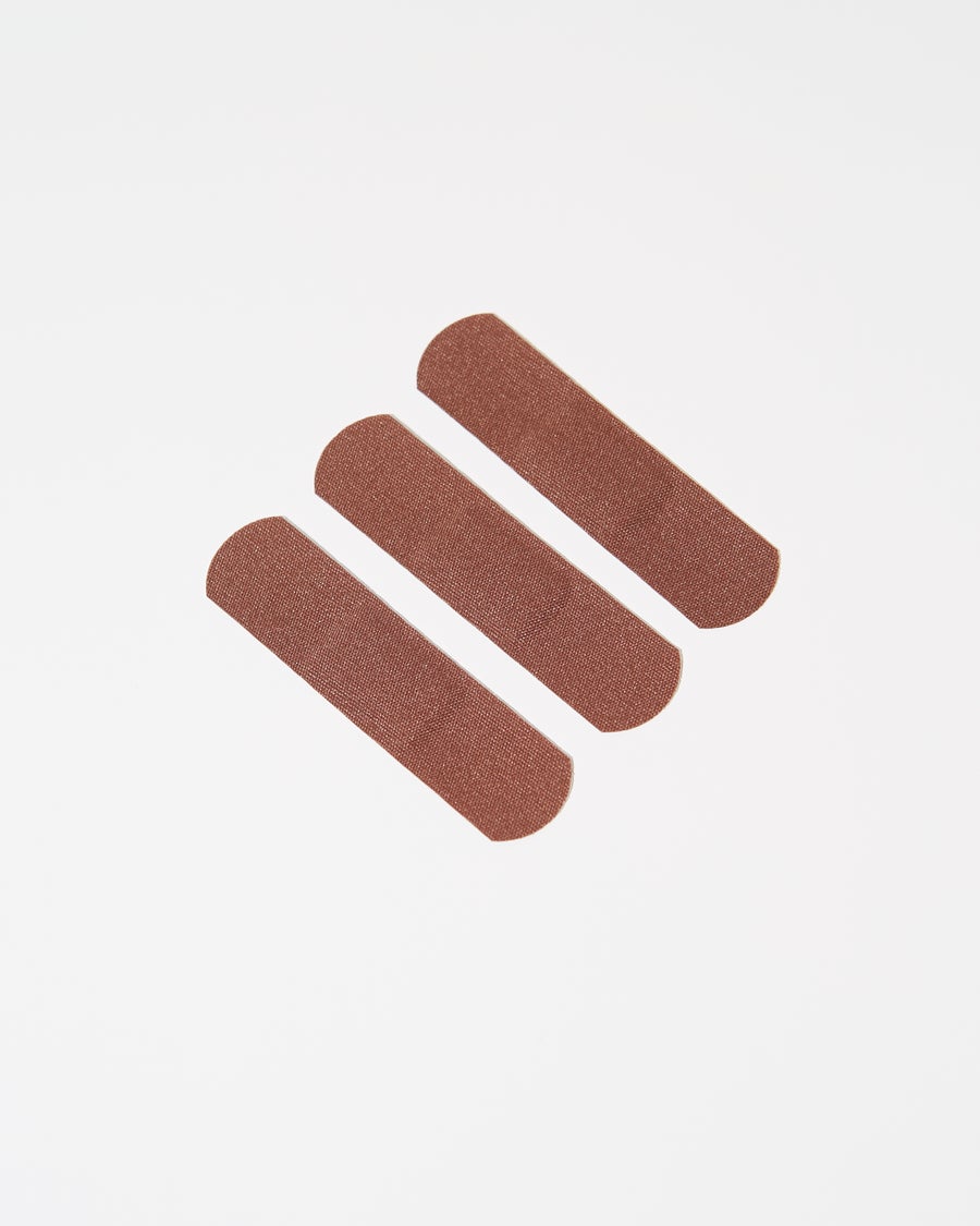 Browndages Bandages in the color "Mocha" for dark complexions. Similar to MAC lipstick color "Consensual" or  Maybelline foundation in "Java".