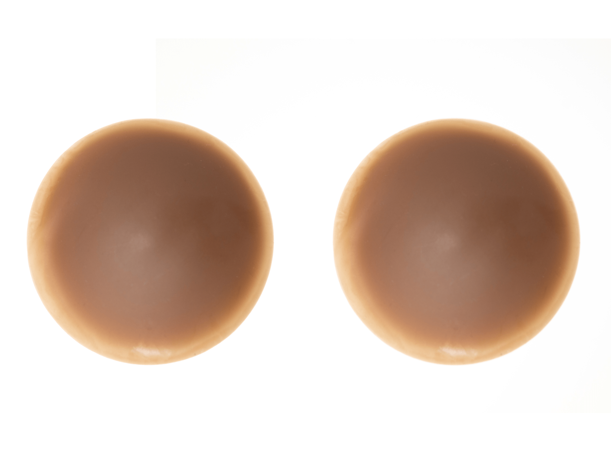 A pair of dark brown nude flesh tone silicone nipple pasties for Black skin.