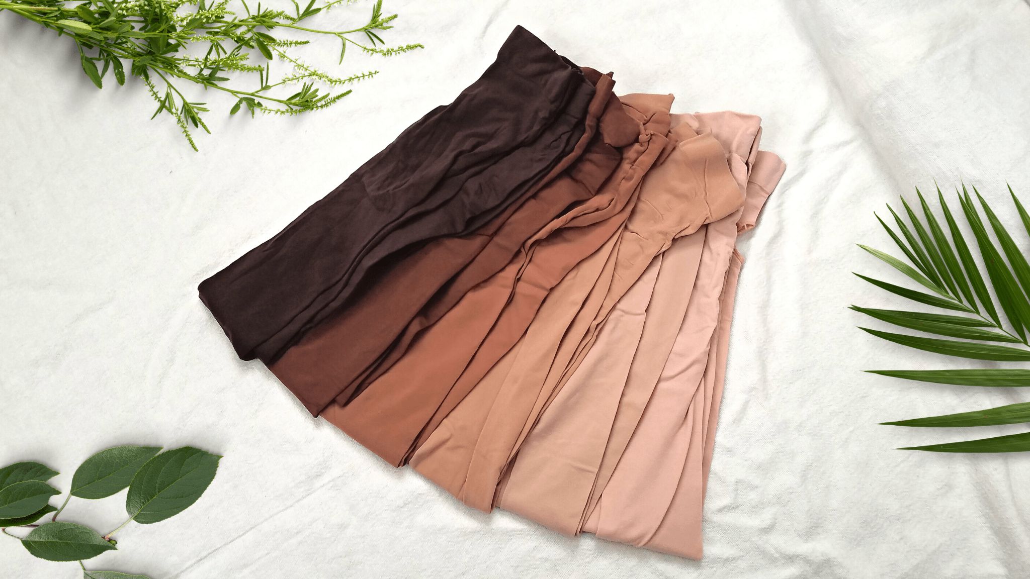 6 nude shades of dance tights arranged from dark to light.