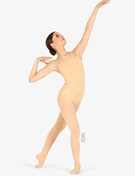 A white woman is posing in women's beige color convertible tights for dancers and figure skaters.