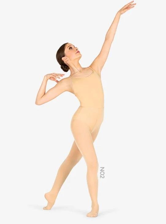 A white woman is posing in women's beige color convertible tights for dancers and figure skaters.