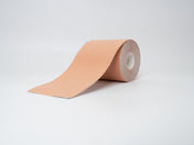 Warm peach colored booby tape for women with warm light skin tones.
